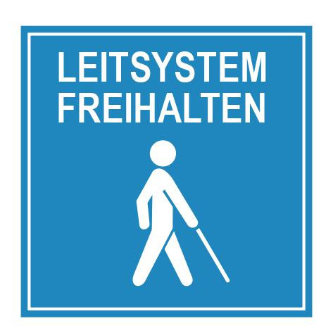 Auf dem Piktogramm steht "Leitsystem freihalten". Es zeigt eine Person mit Langstock in Weiß auf blauem Hintergrund.